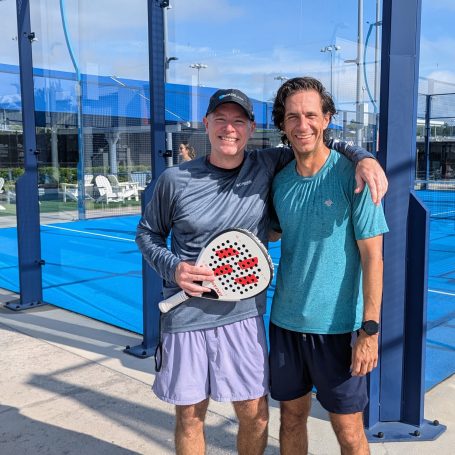 Two players pausing for a photo on a padel court at the USTA National Campus in Orlando, FL